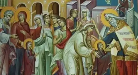 Християнското семейство празнува на Въведение Богородично, сложете риба и вино на масата